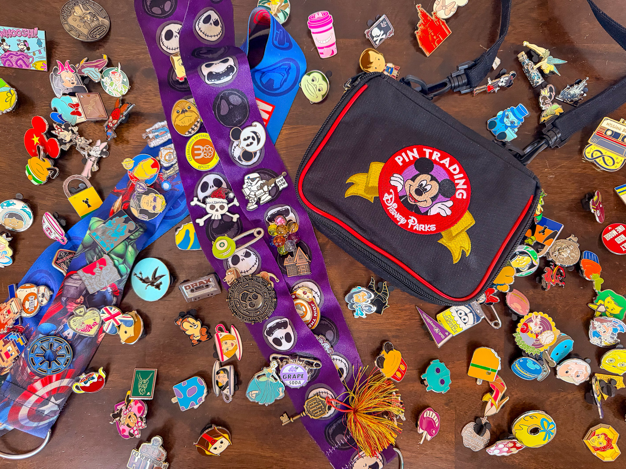 Family meeting Belle at Walt Disney World with multiple guests wearing colorful Disney pin trading lanyards.