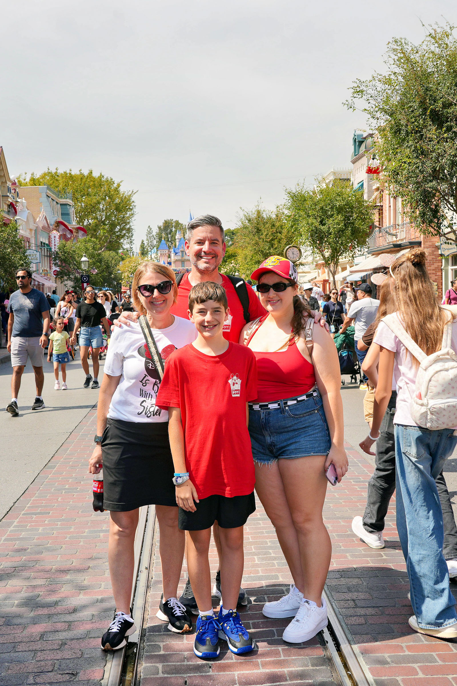 Family on Main Street U.S.A. with Sleeping Beauty Castle at Disneyland