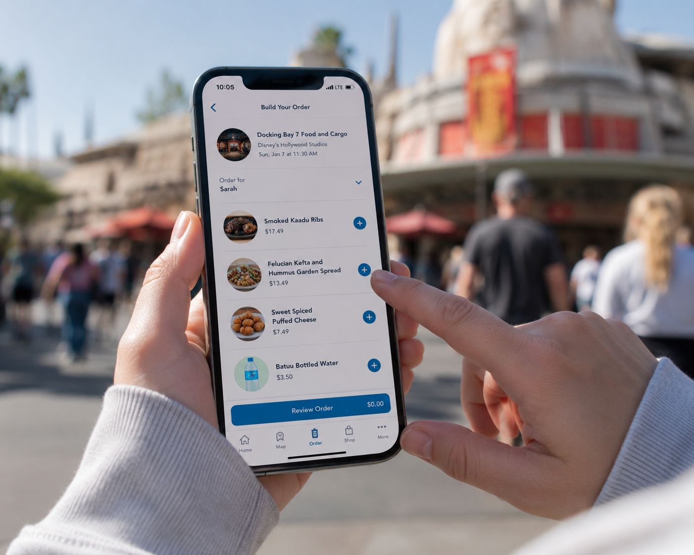 Person using the My Disney Experience app to mobile order food at a Disney World quick-service restaurant.