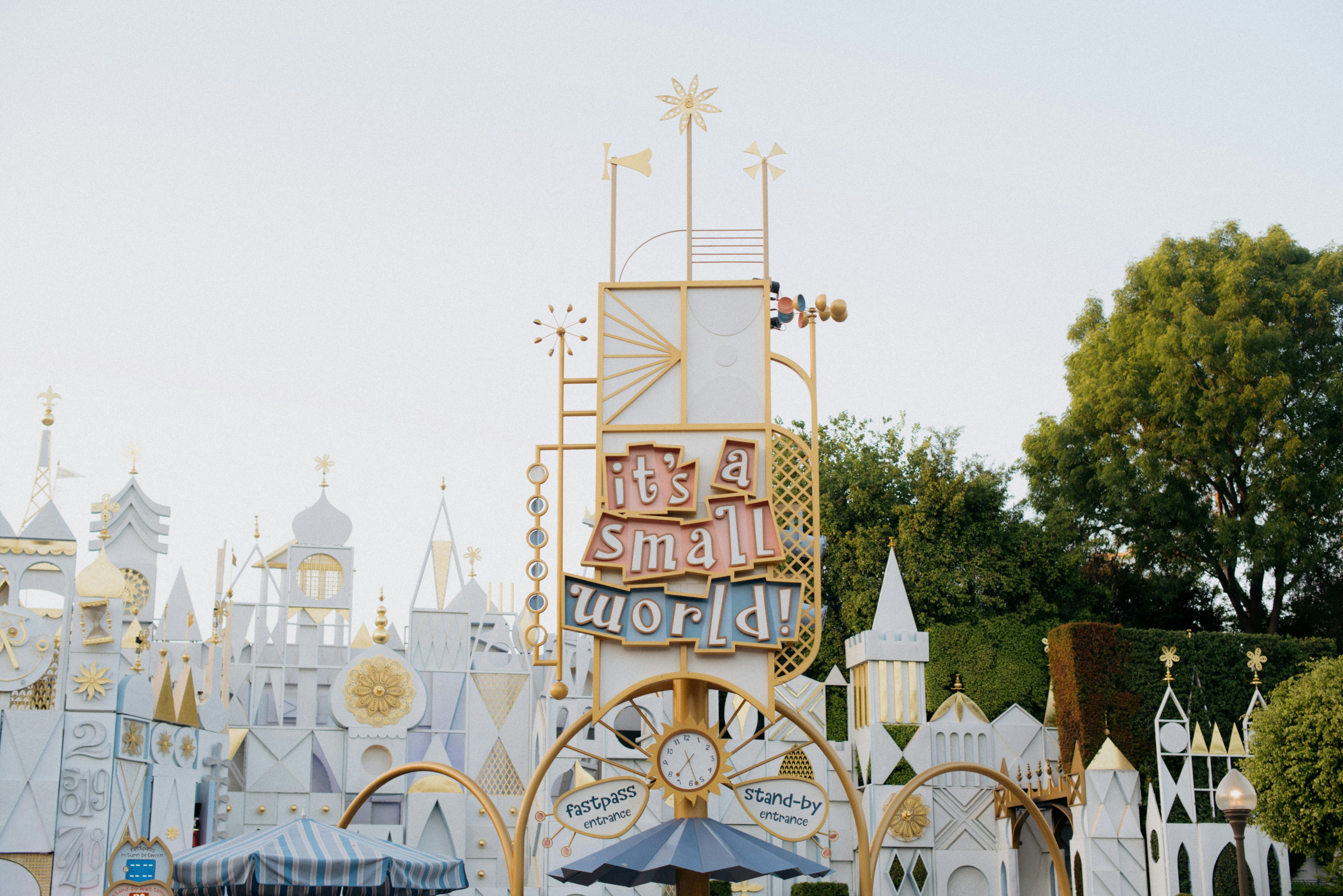 It's a Small World ride entrance at Disneyland with the iconic clock tower and colorful facade.